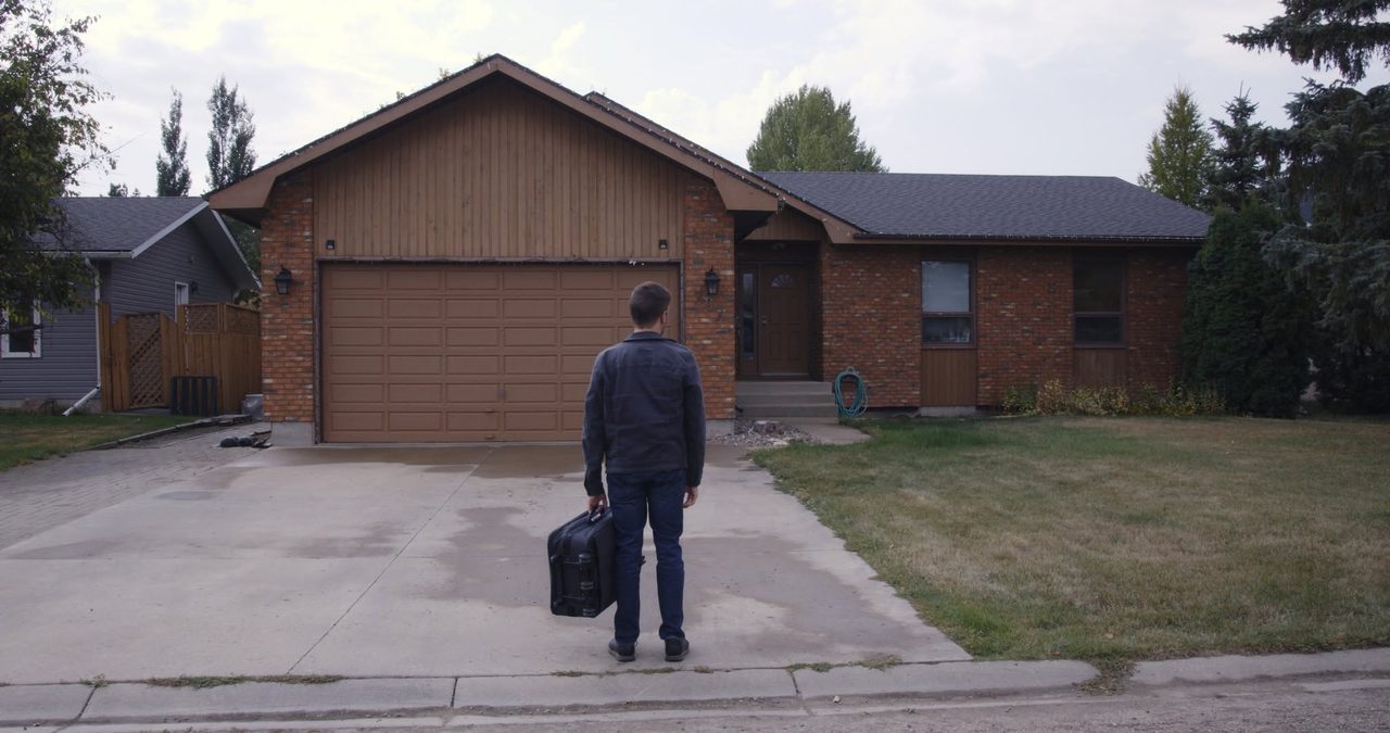 Finding Emily film still: father outside the home